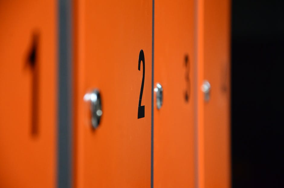 Modern orange gym lockers representing wellness amenities